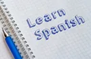 Learn Spanish written on notebook.