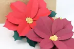 Red Poinsettias made out of paper.