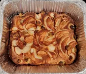 Image of a focaccia covered with fruit.