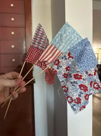 3 handmade farmhouse flags made out of fabric.