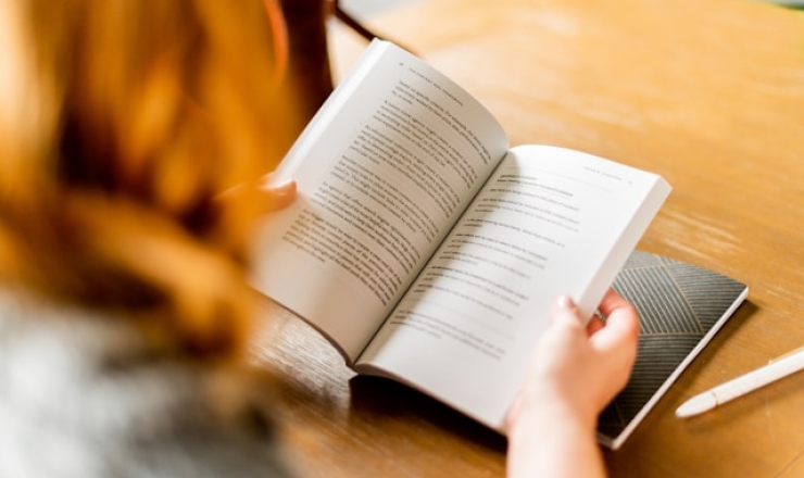 person reading at table